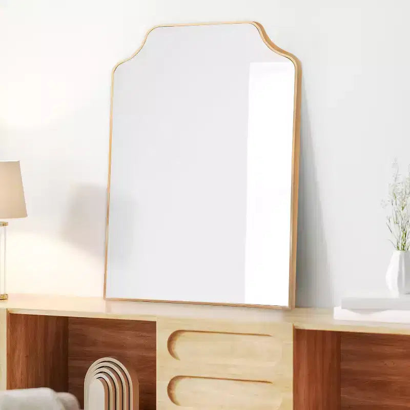 Miroir mural à cadre métallique et bord festonné